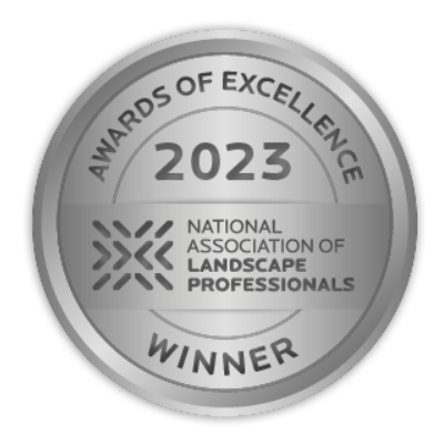 Silver circular award for 2023, stating "Awards of Excellence" from the National Association of Landscape Professionals. The word "Winner" is at the bottom.